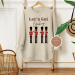 NUTCRACKER SWEATSHIRT | BEIGE SWEATSHIRT WITH BROWN TEXT LET’S GET CRACKING AND BLACK NUTCRACKER SOLDIERS